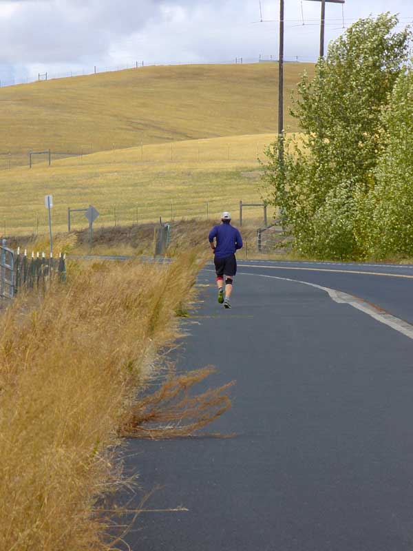 Keep healthy while running. Runner rounds corner at MooScience.